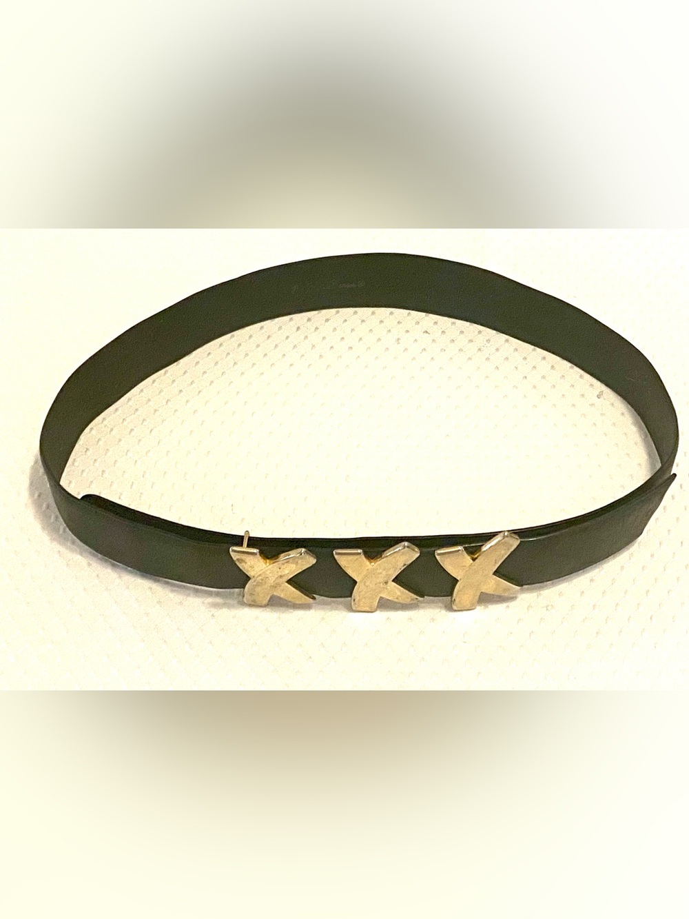 Paloma Picasso Black Leather Belt with Triple X Accent. Shows signs of wear.